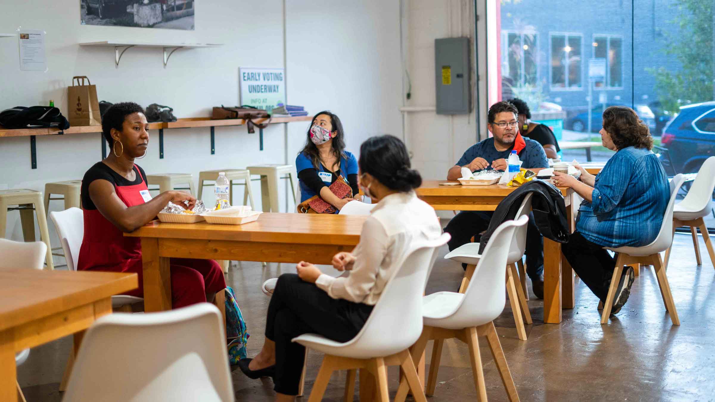 Folks sit around tables at the Catalyst Meet and Greet, Asheville, NC.