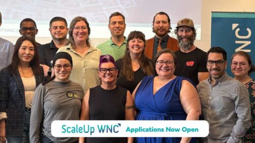 Group photo of ScaleUp Cohort 13 including text "ScaleUp WNC Applications Now Open"